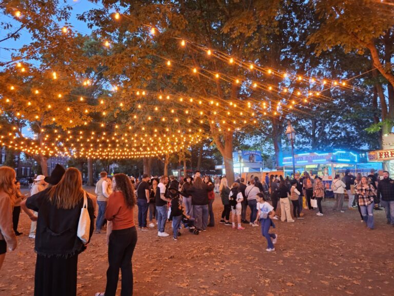 Families enjoying an evening in Salem Massachusetts during the Halloween season